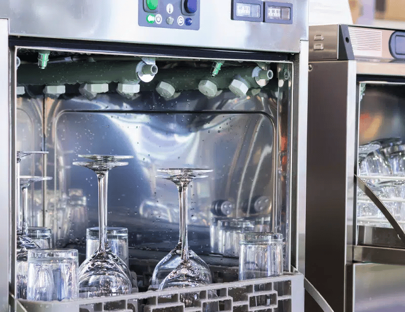 commercial warewasher with cleaned glasses